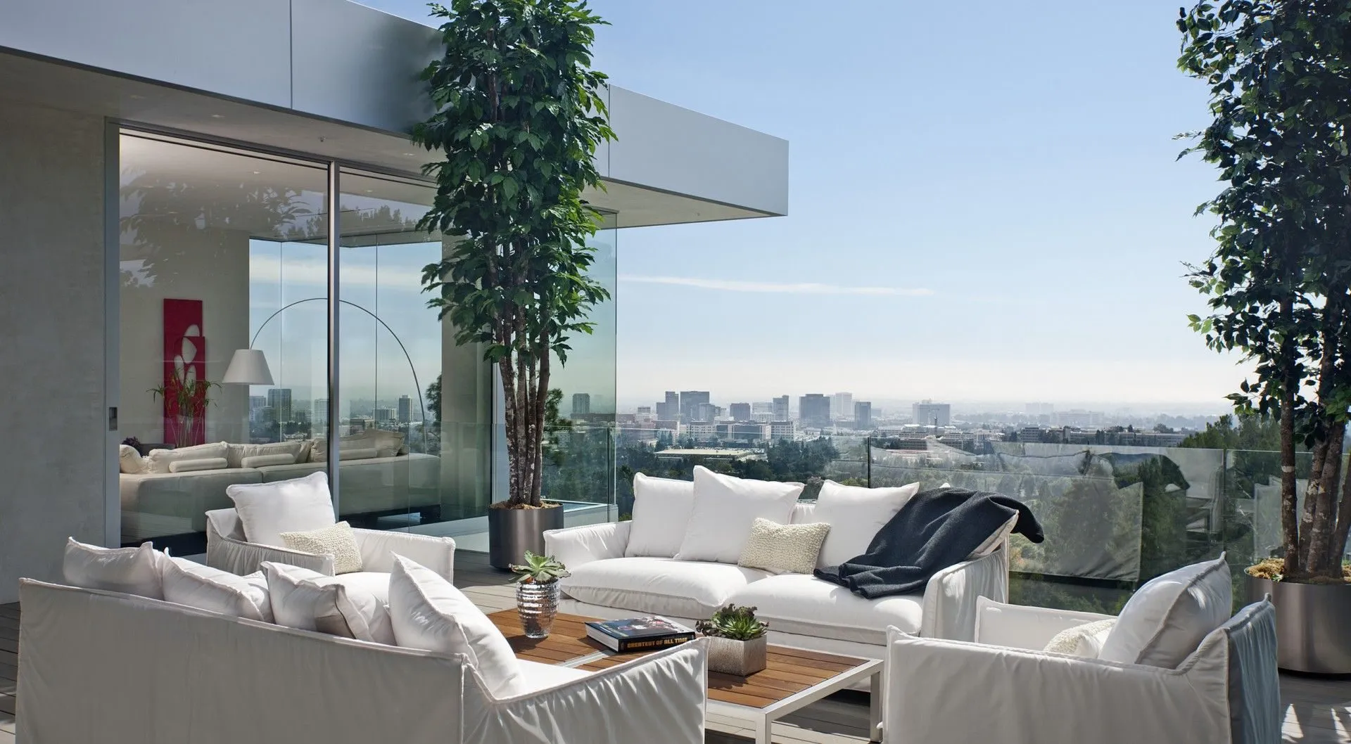 Outdoor lounge terrace with vertical planting and city views