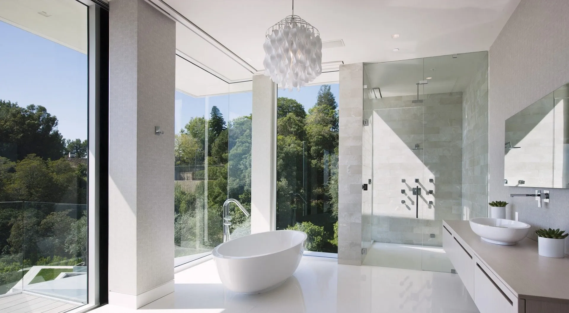 Bathroom with freestanding tub and hillside views
