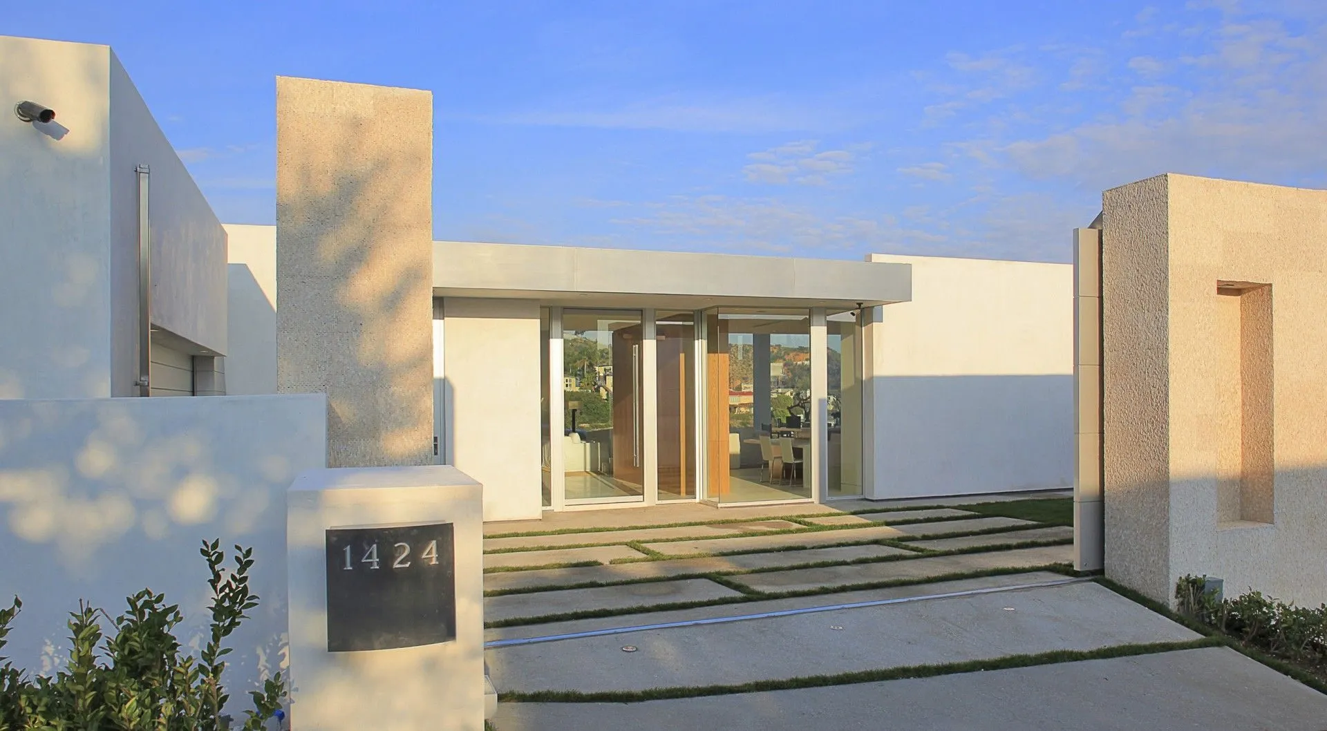 Tanager I gated entry court at sunset