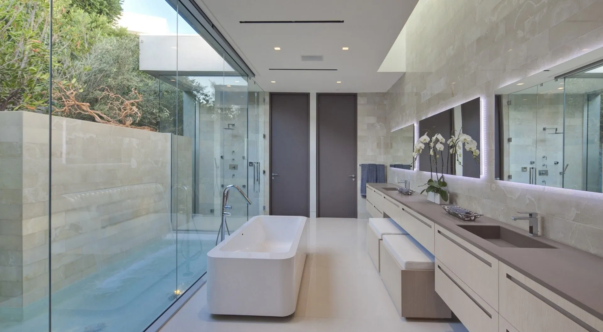 Bathroom with freestanding tub, skylight, and private courtyard