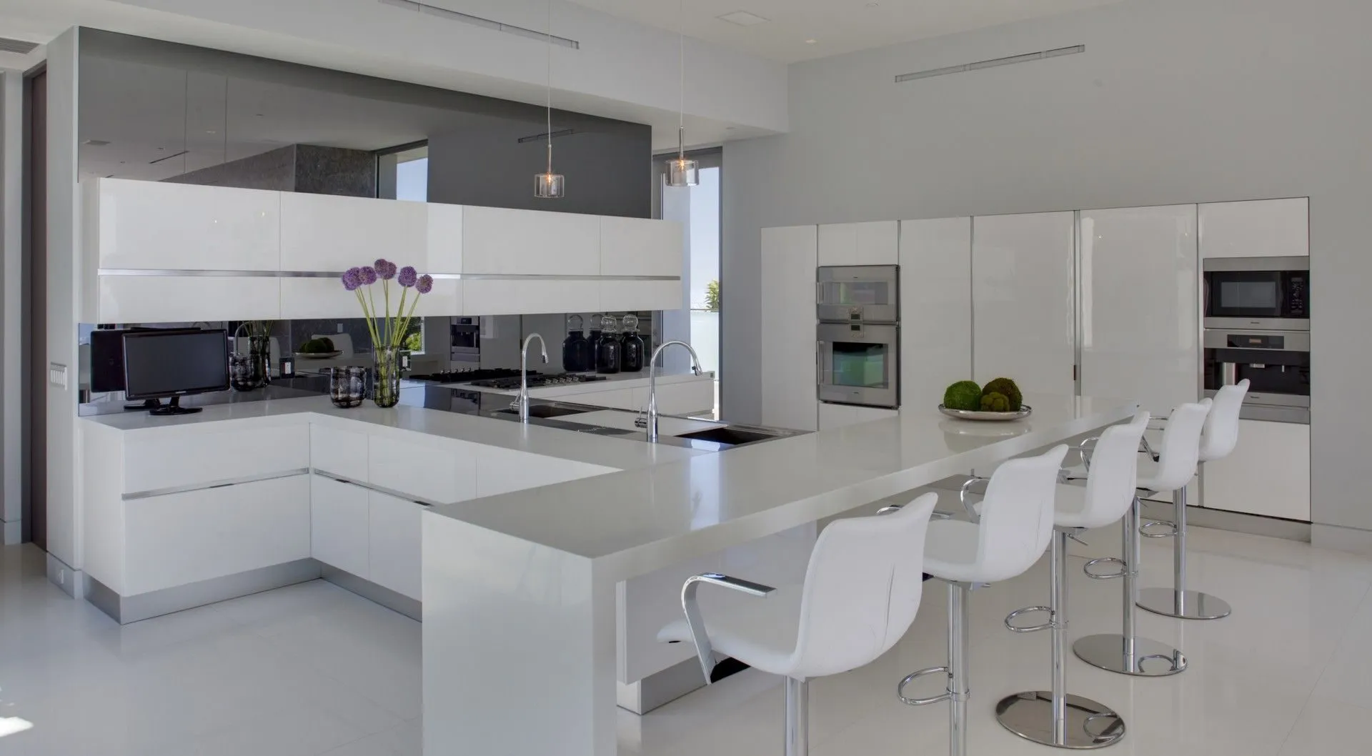 White kitchen with island and breakfast seating
